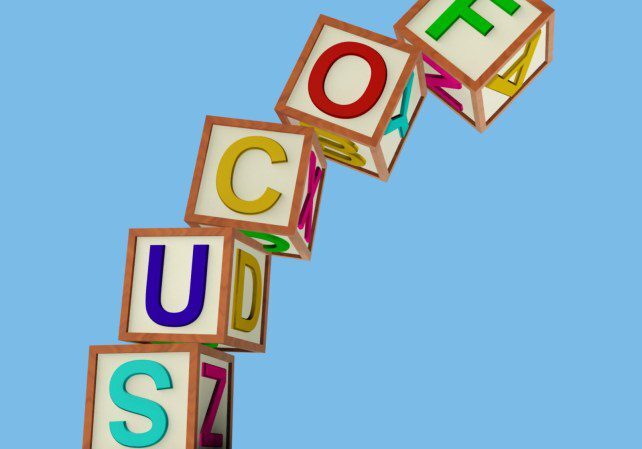 blocks-spelling-focus-falling-over-as-symbol-for-lack-of-concentration_zyKAGSPd