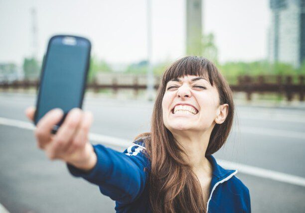graphicstock-beautiful-woman-selfie-in-a-desolate-lurban-landscape_BgJxmJbxZ
