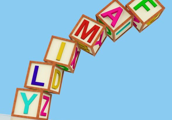 kids-blocks-spelling-family-falling-over-as-symbol-for-problems-with-parent_zyXVWrw_